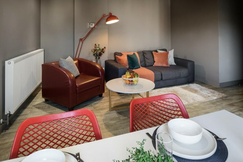 Property photo 2 of 7 A Stylish And Modern Living Room Featuring A Comfo...