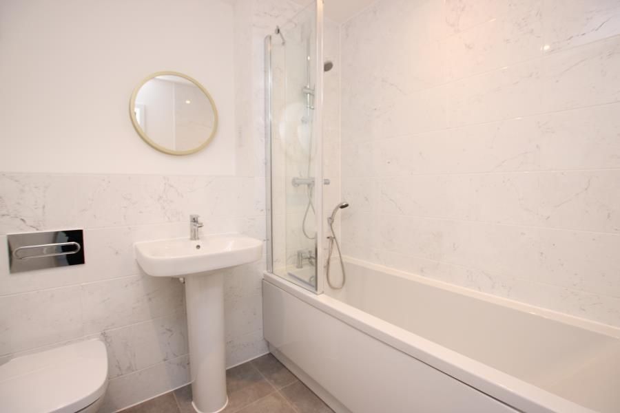 Property photo 3 of 9 Bright, Modern Bathroom With A Full-Length Bathtub...