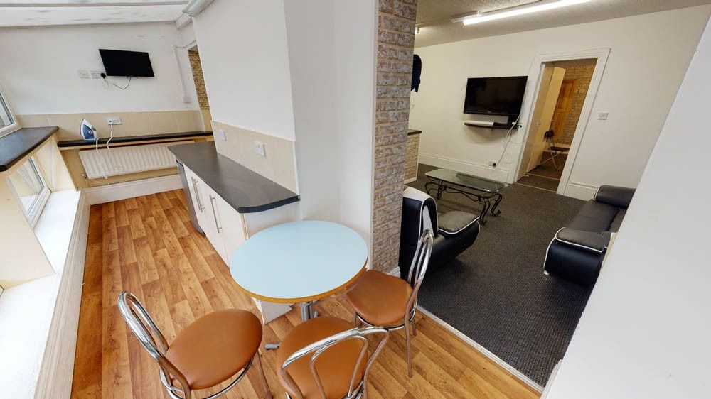 Property photo 1 of 7 A Bright, Modern Living Room Featuring Ample Natur...