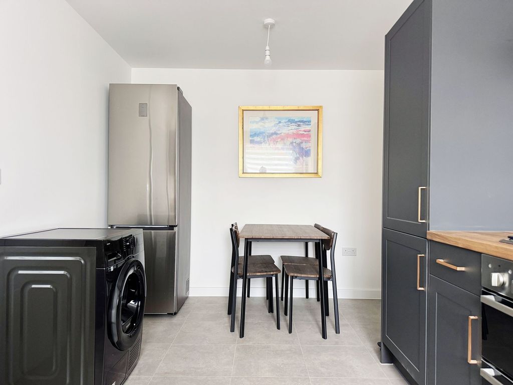 Property photo 2 of 9 Modern Kitchen With Dining Area And Sleek Units...