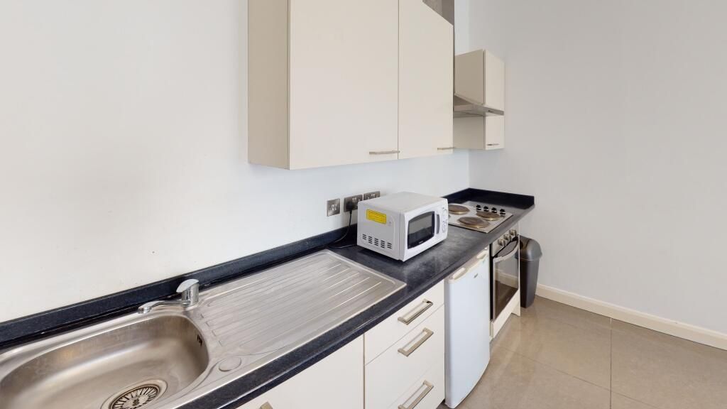 Property photo 2 of 6 A Clean And Modern Kitchen With Ample Counter Spac...
