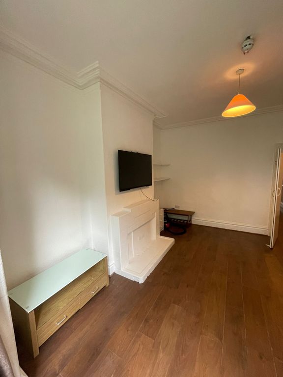 Property photo 2 of 11 A Cozy Living Room Featuring A Fireplace And Ample...