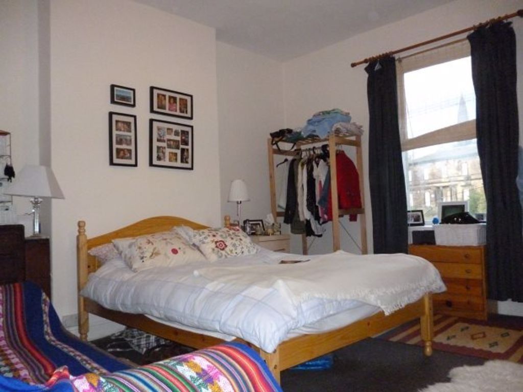 Property photo 2 of 12 A Cozy Double Bedroom Featuring A Wooden Bed Frame...