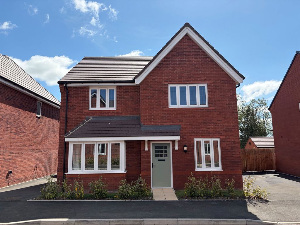 Property photo 1 of 10 A Red Brick House With White-Framed Windows And A Light Green Door Sits On A Paved Driveway With Sma