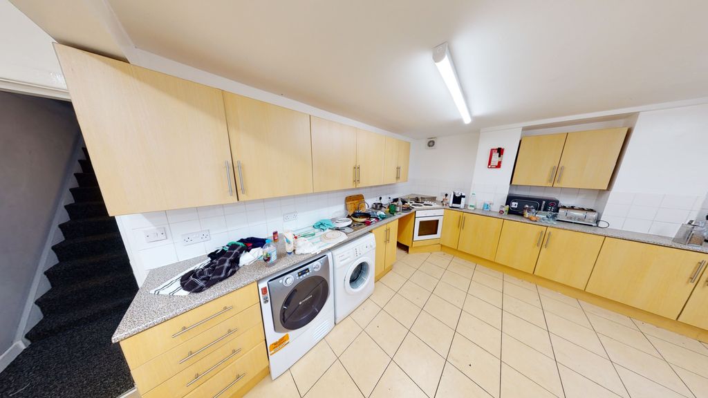 Property photo 2 of 7 Bright And Spacious Kitchen Featuring Ample Storag...