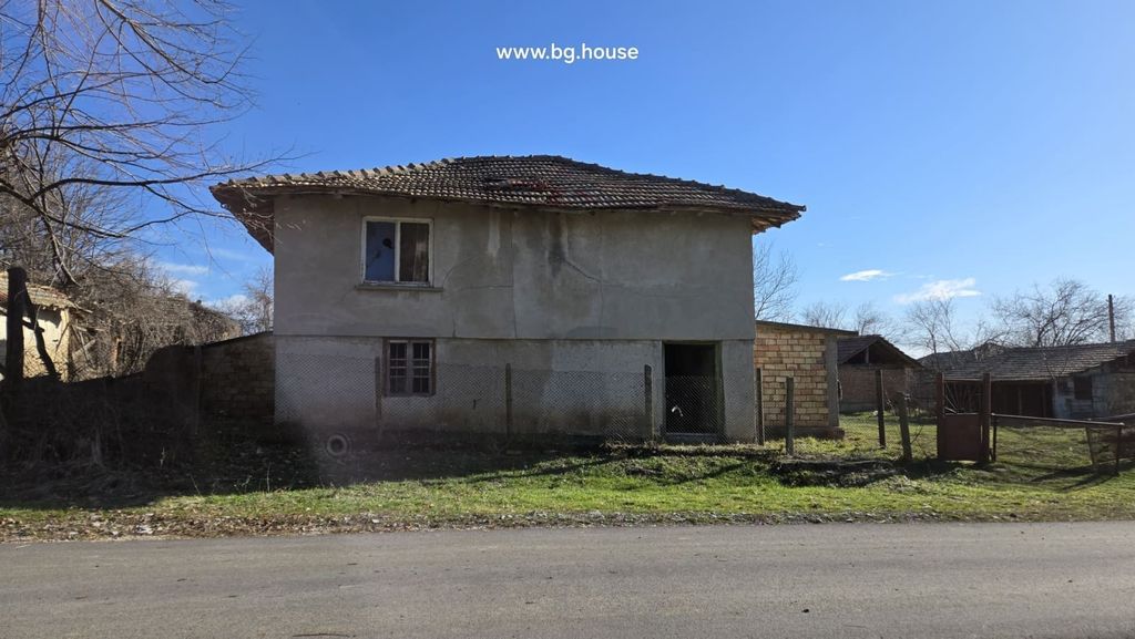 Property photo 1 of 24 Front View Of A Two-Storey Rural House With Plastered Walls And Tiled Roof Beside A Road