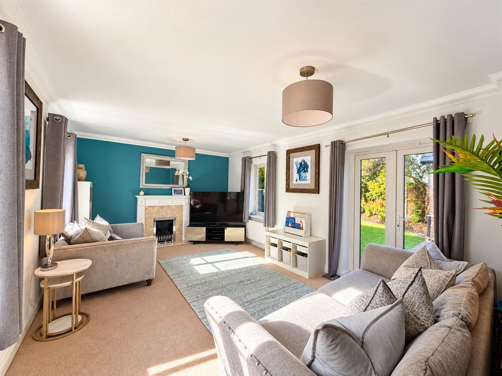 Property photo 2 of 21 Sunlit Teal-Accented Contemporary Living Room.Png
