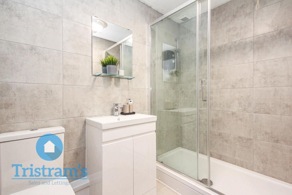 Property photo 2 of 9 Modern Tiled Bathroom With A Glass-Enclosed Shower...