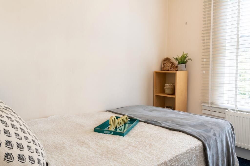 Property photo 3 of 7 A Cozy Double Bedroom Featuring Natural Light From...