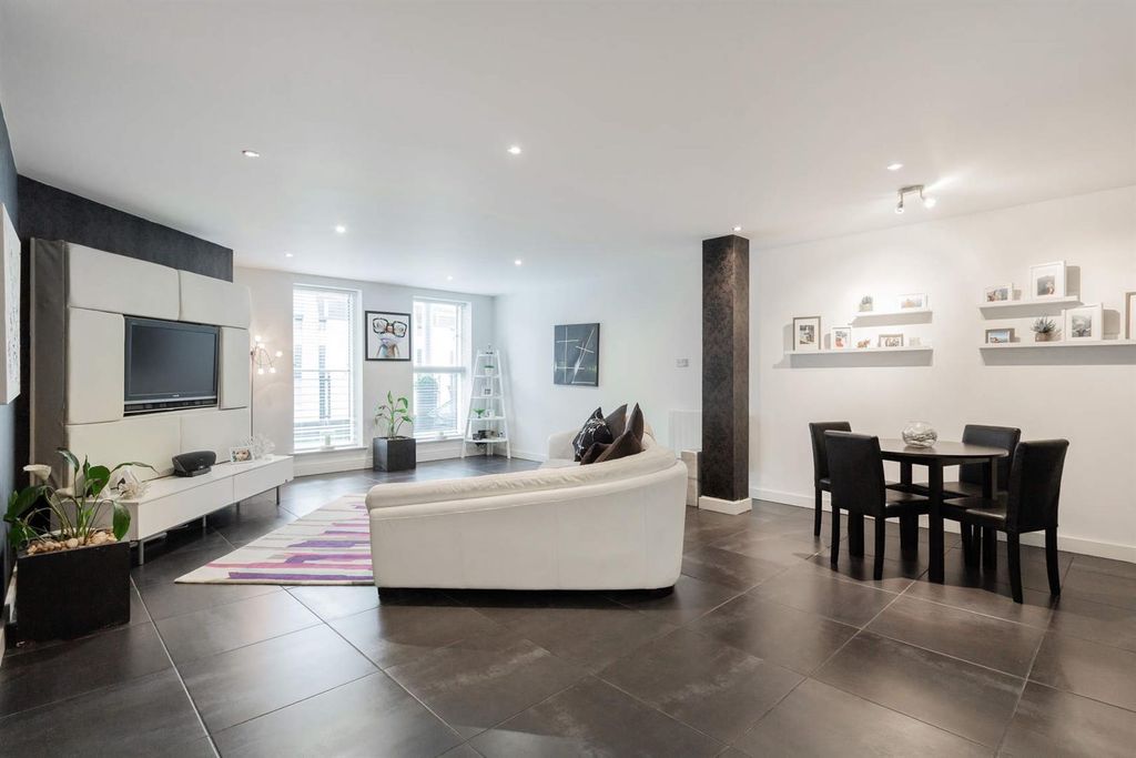 Property photo 2 of 10 Expansive Modern Lounge With Sleek Dining Area...