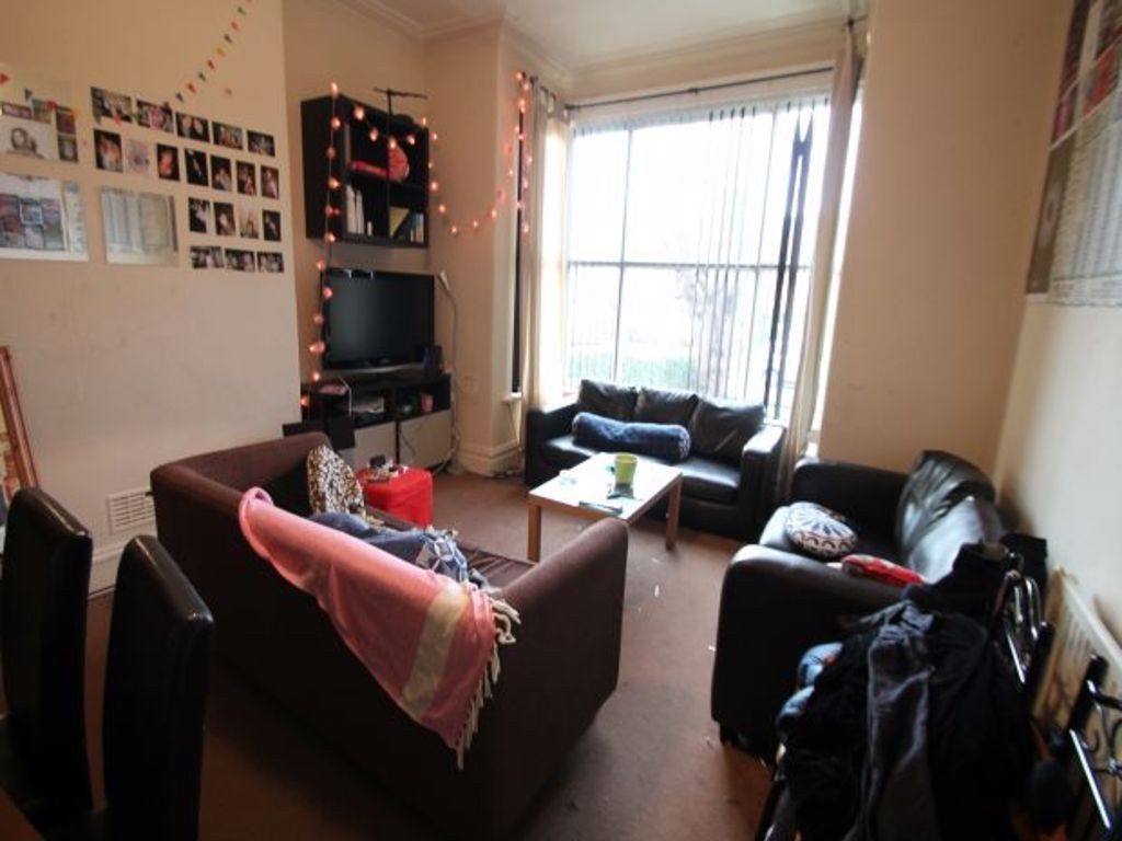 Property photo 3 of 15 A Cozy Living Room With A Large Window Allowing Na...