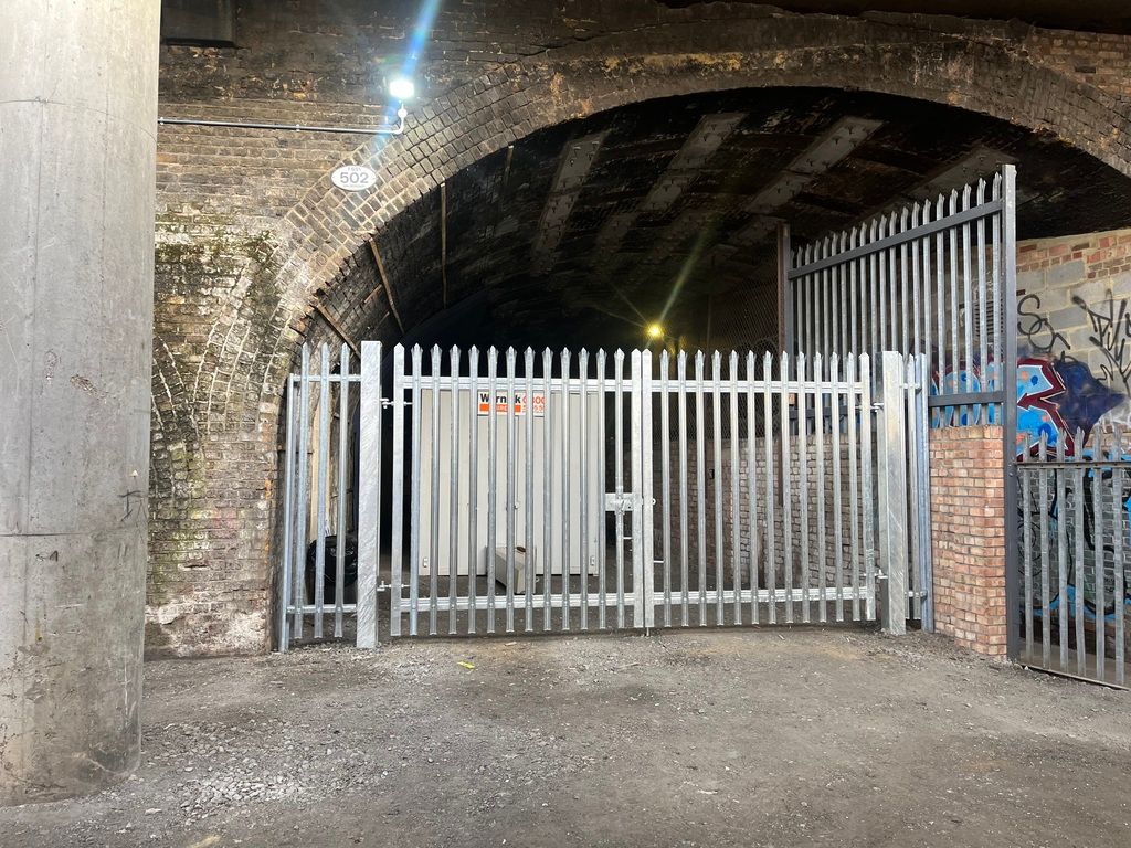 Property photo 2 of 5 An Open Yard With Metal Fencing Around It.