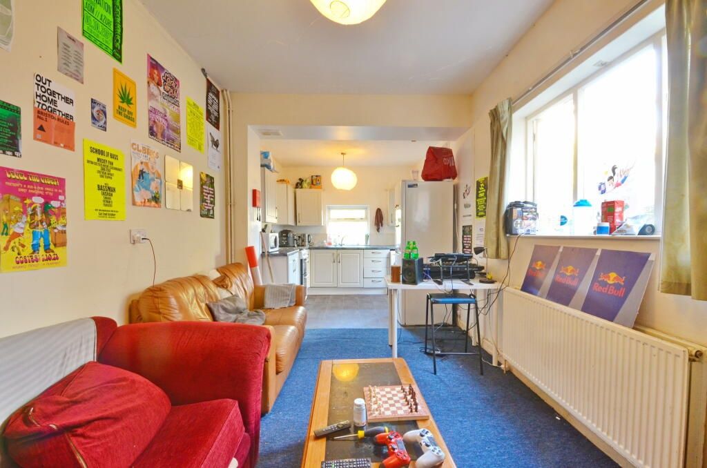 Property photo 2 of 6 Bright And Inviting Living Room Featuring Large Wi...