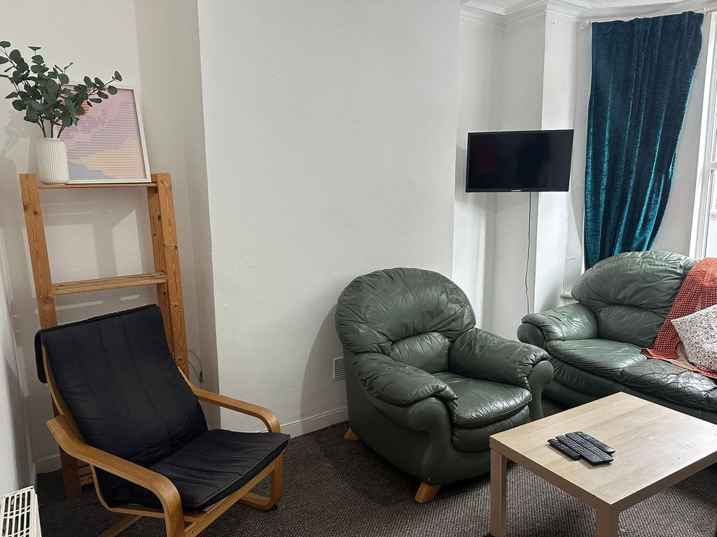 Property photo 2 of 19 A Cozy Living Room Featuring Comfortable Leather S...