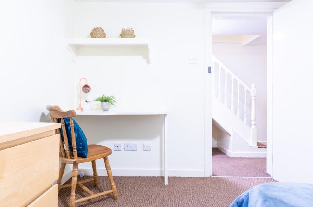 Property photo 2 of 14 A Bright And Inviting Hallway Featuring A Simple d...