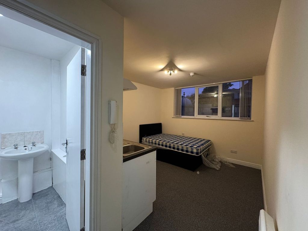 Property photo 2 of 2 A Cozy Bedroom Featuring A Large Window Allowing N...