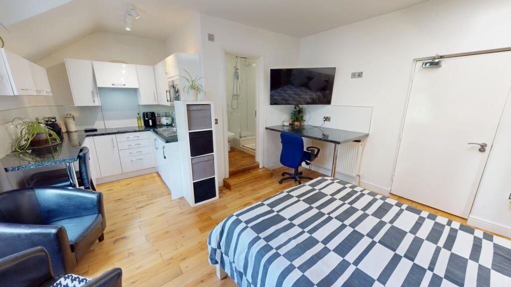 Property photo 2 of 6 Spacious And Bright Master Bedroom Featuring A Com...