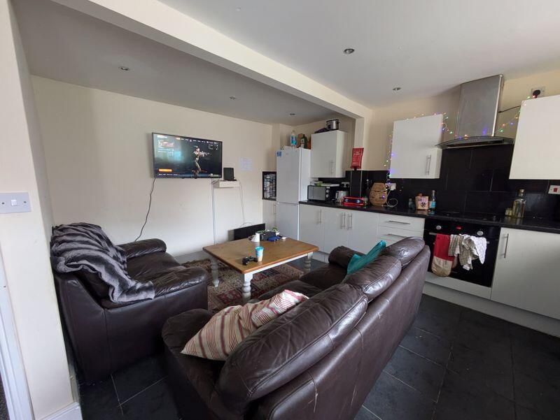 Property photo 3 of 9 A Modern And Inviting Living Room Featuring Comfor...