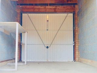 Property photo 2 of 11 Garage