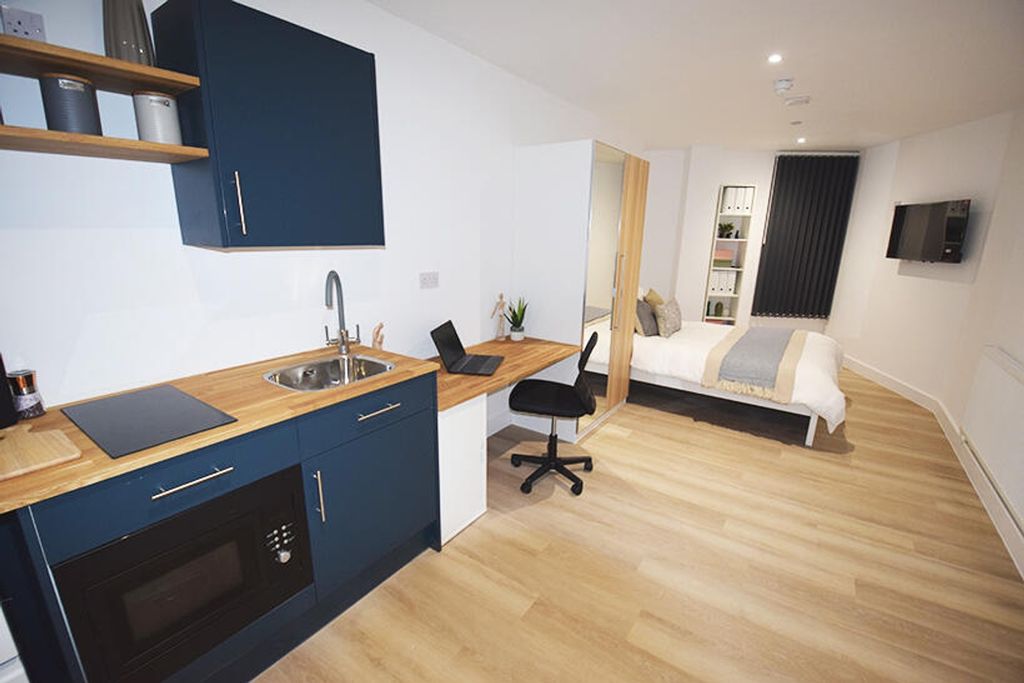 Property photo 1 of 4 This Stylish Double Bedroom Features A Modern Kitc...