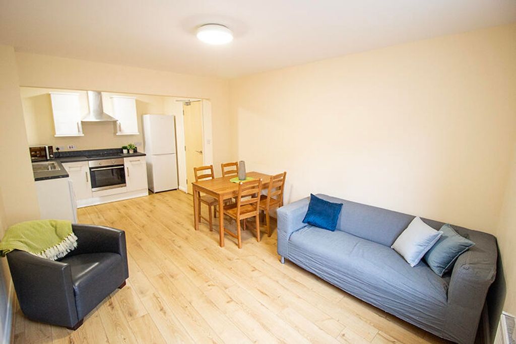 Property photo 1 of 5 Spacious And Inviting Living Room Featuring A Comf...