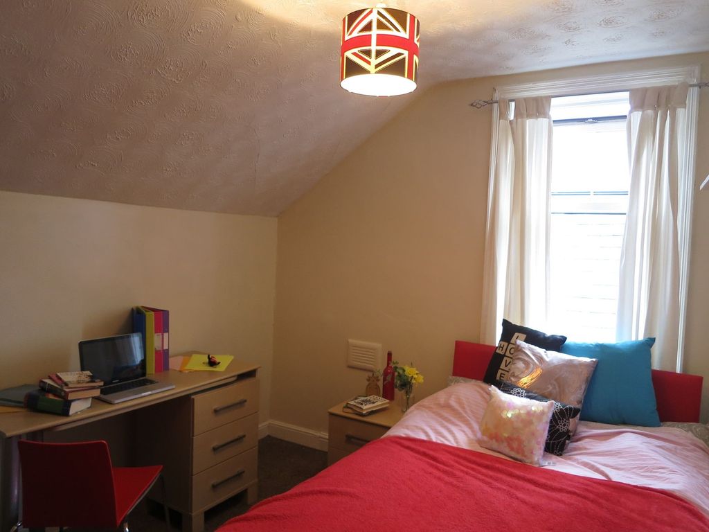 Property photo 2 of 15 A Bright And Cozy Bedroom Featuring A Large Window...