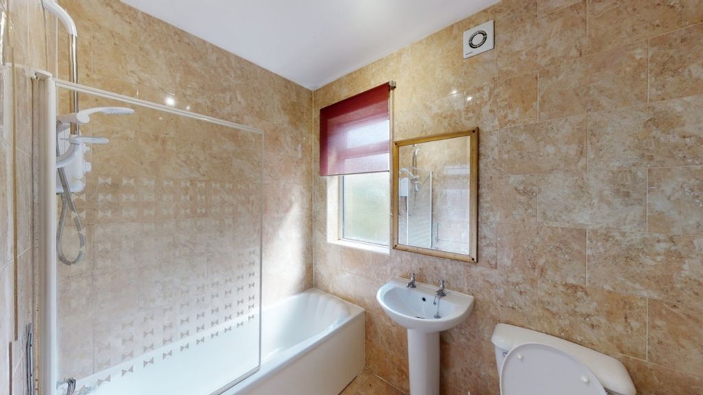 Property photo 3 of 11 A Spacious And Modern Bathroom Featuring A Bath An...