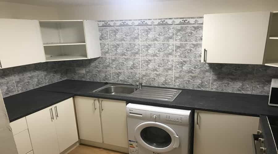 Property photo 1 of 7 A Compact, Modern Kitchen With White Cabinets, Gre...