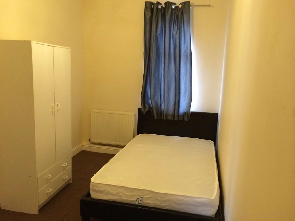 Property photo 1 of 8 A Cozy Bedroom Featuring A Single Bed, A Wardrobe,...
