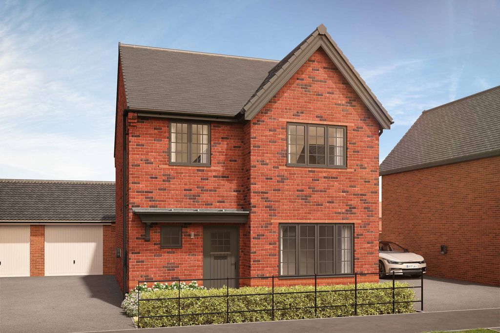 Property photo 1 of 10 A Red Brick House With A Black Fence And Manicured Bushes In The Foreground Stands Before A Clear Bl