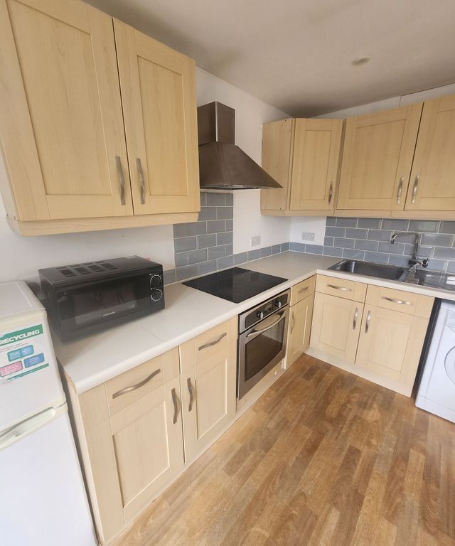 Property photo 1 of 10 Bright And Tidy Kitchen Featuring Light Wood Cabin...