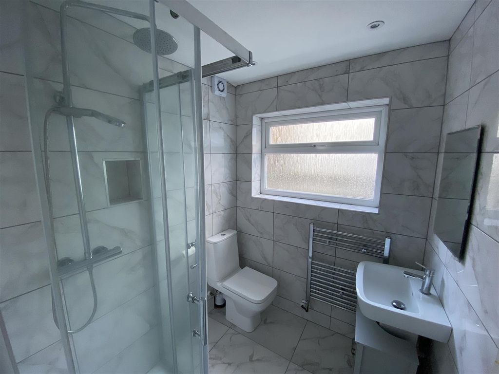 Property photo 3 of 8 Modern Tiled Bathroom With Sleek Rainfall Shower...