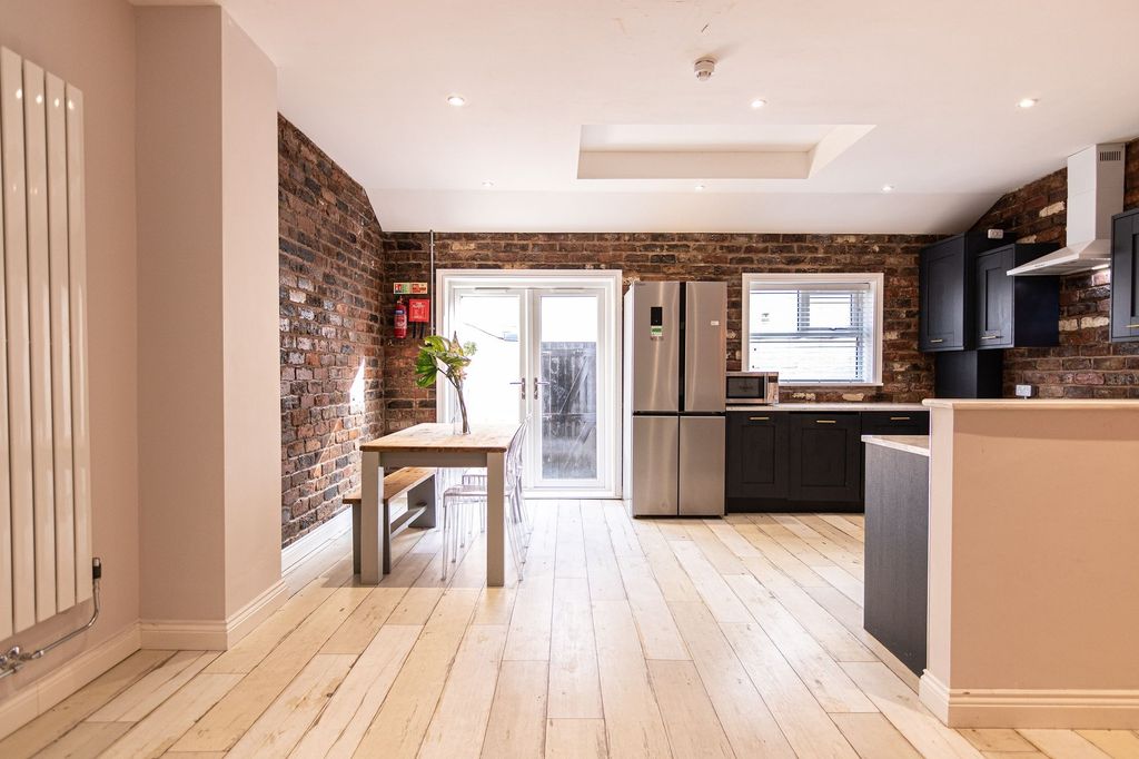 Property photo 3 of 11 Bright Open-Plan Kitchen And Dining Area With Expo...