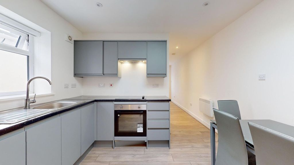 Property photo 3 of 19 Bright Modern Kitchen With Sleek Grey Cabinetry, i...