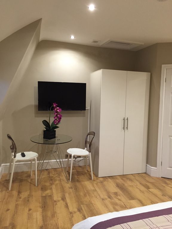 Property photo 3 of 5 Bright, Modern Bedroom Corner With Wood-Effect Flo...