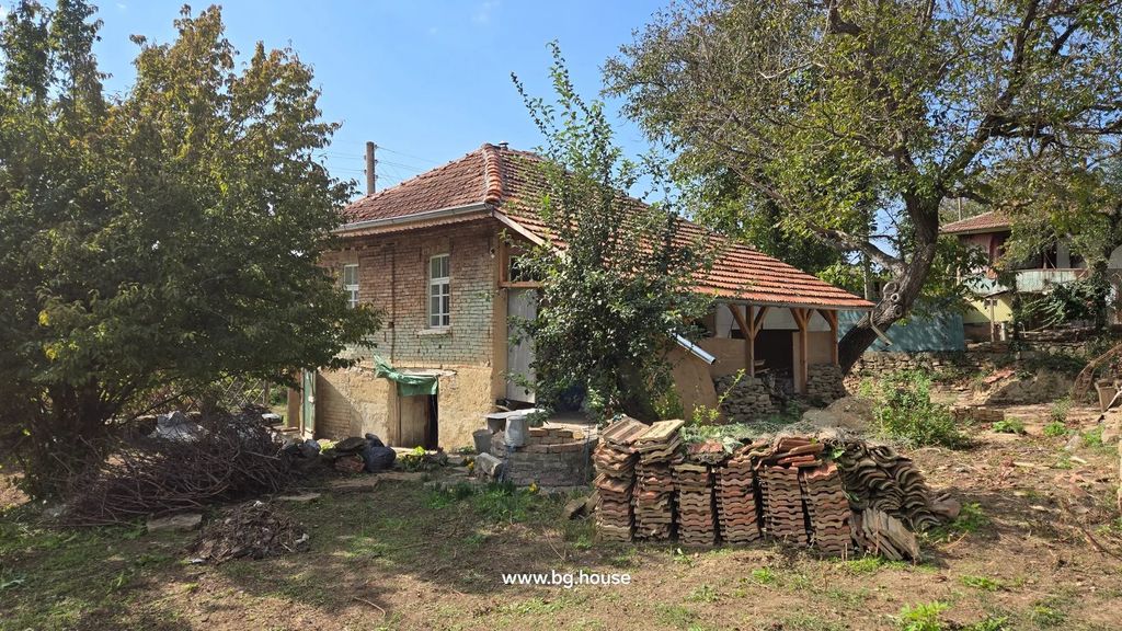 Property photo 1 of 40 Brick House With Tiled Roof, Trees Around, And Stacks Of Roof Tiles In The Garden Area