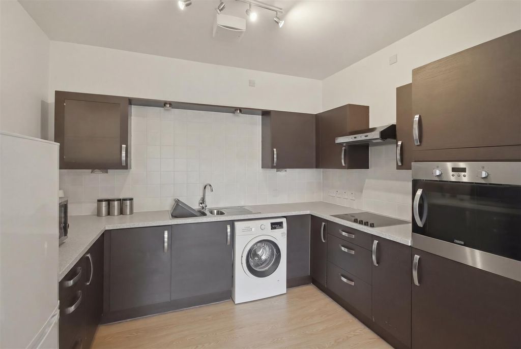 Property photo 2 of 12 Kitchen Area
