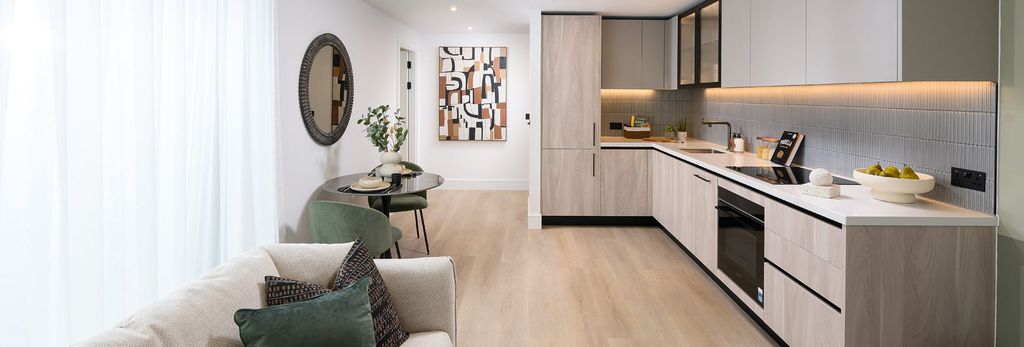Property photo 2 of 5 Kitchenette With Light Brown Grey Surfaces, White Countertops, Strip Lighting And Light Grey
