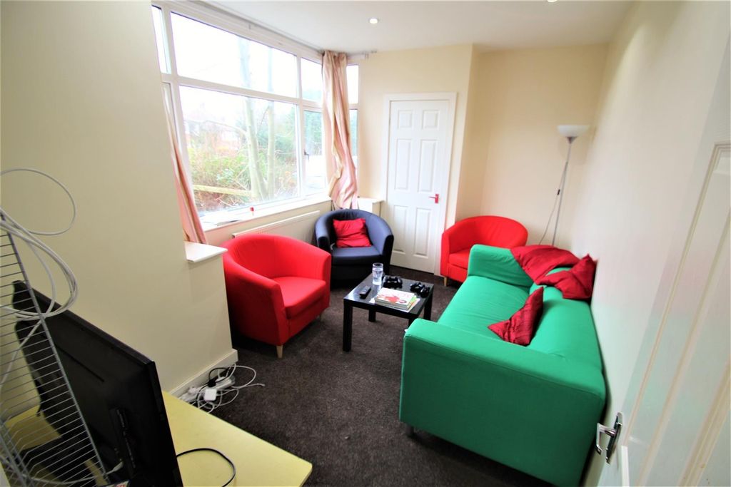 Property photo 3 of 9 Bright And Welcoming Living Room Featuring A Varie...