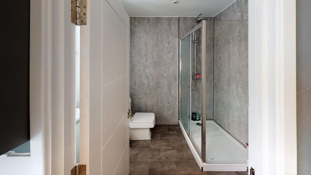 Property photo 1 of 9 A Modern And Stylish Bathroom Featuring A Spacious...