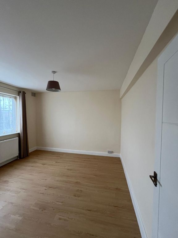 Property photo 1 of 15 Bright, Empty Bedroom With Wood-Effect Flooring, A...