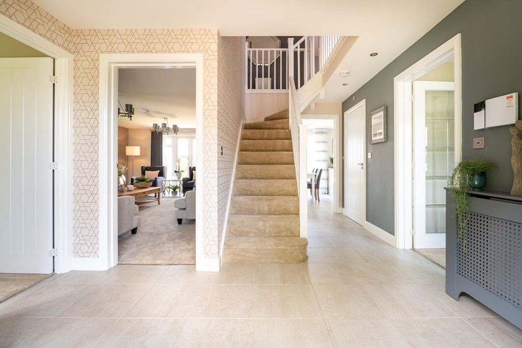 Property photo 3 of 13 A Welcoming Hallway With Central Staircase