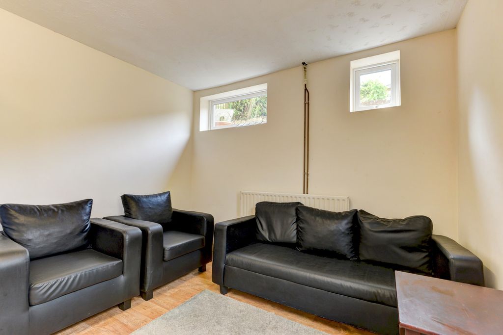 Property photo 1 of 19 A Bright And Tidy Living Room Featuring Comfortabl...