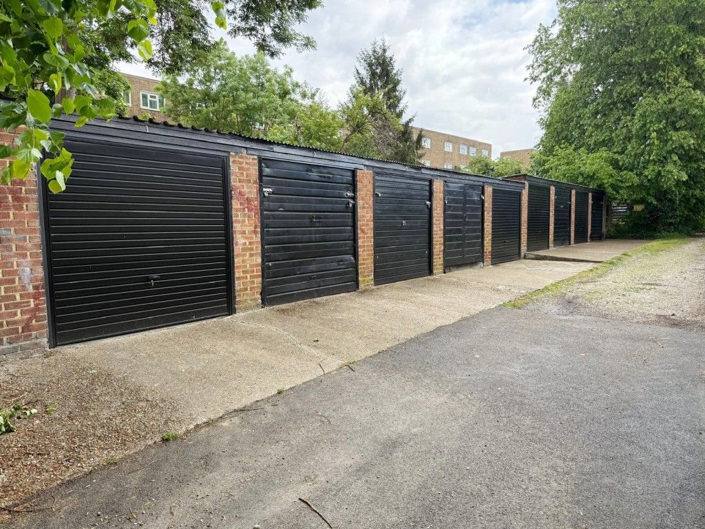 Property photo 1 of 5 View Of Garages From Driveway Access