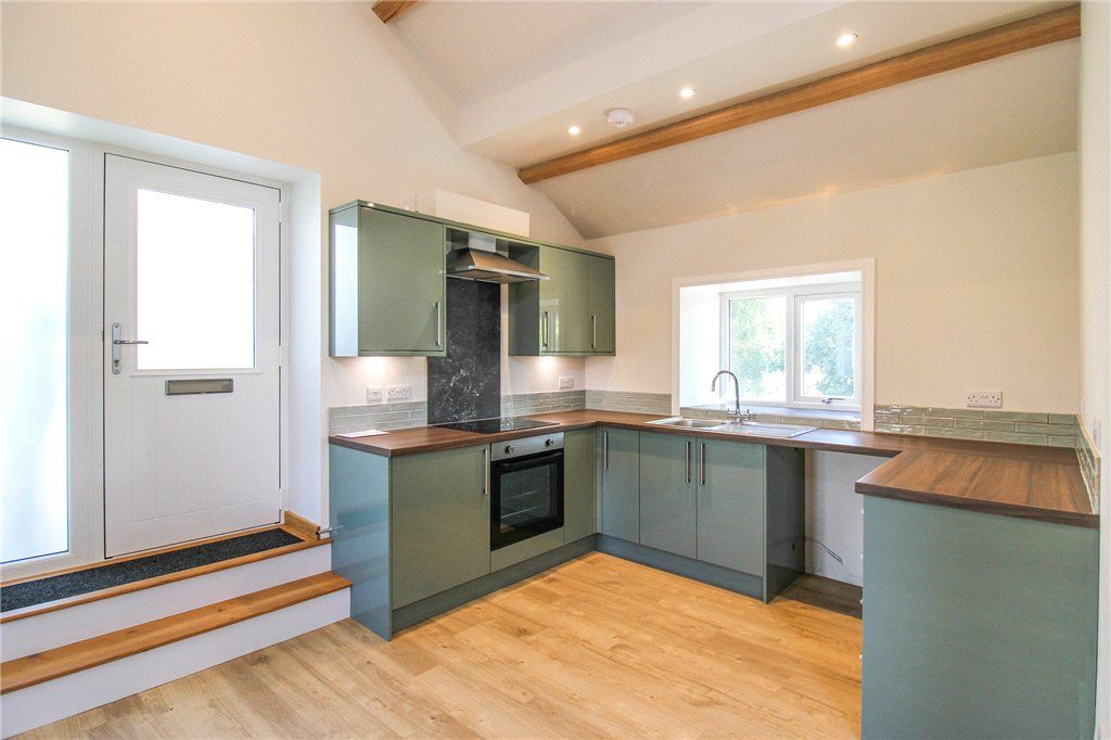 Property photo 3 of 8 Kitchen Area