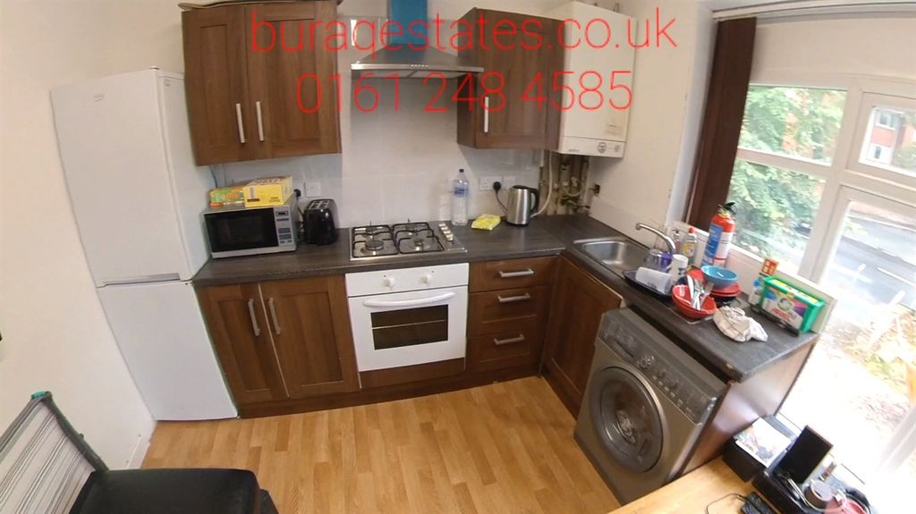 Property photo 2 of 6 Bright Fitted Kitchen With Wood-Style Cabinets, Ga...