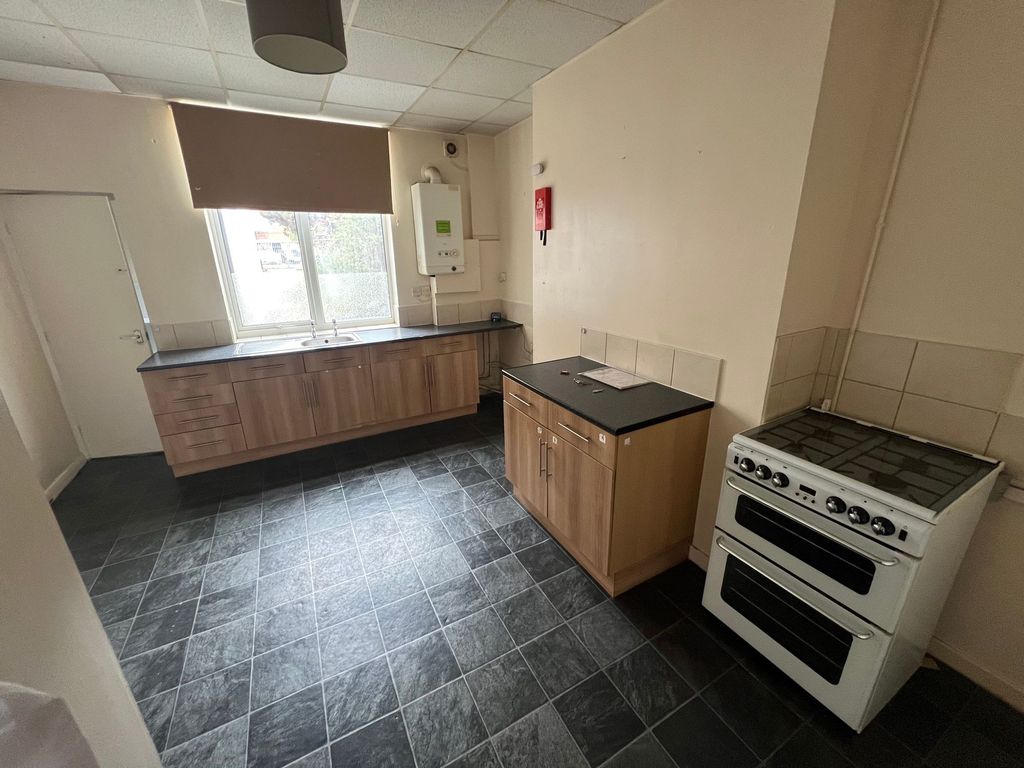 Property photo 2 of 5 A Clean And Functional Kitchen With Modern Wooden ...