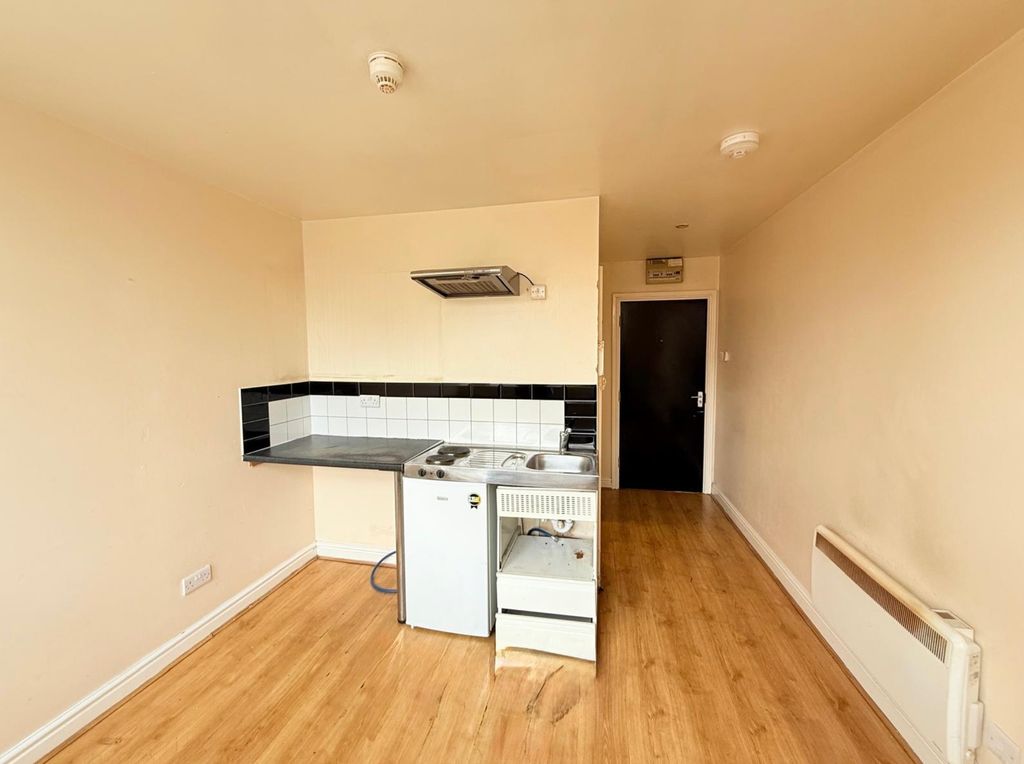 Property photo 1 of 14 Compact Kitchen Area Featuring A Small Fridge, Sin...