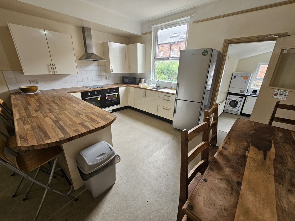 Property photo 2 of 15 Bright And Well-Maintained Kitchen Featuring Moder...