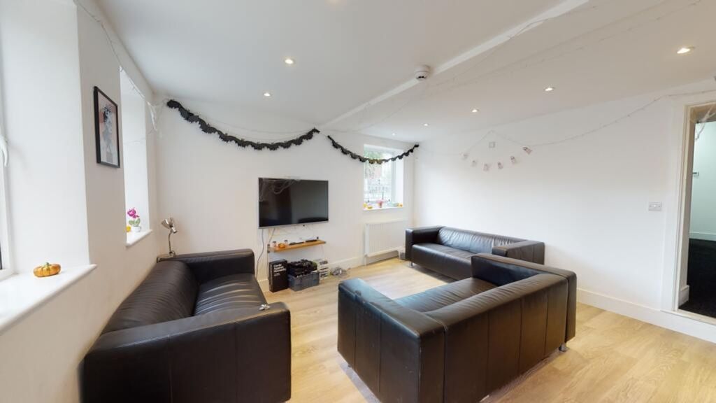 Property photo 2 of 10 A Bright And Inviting Living Room Featuring Modern...